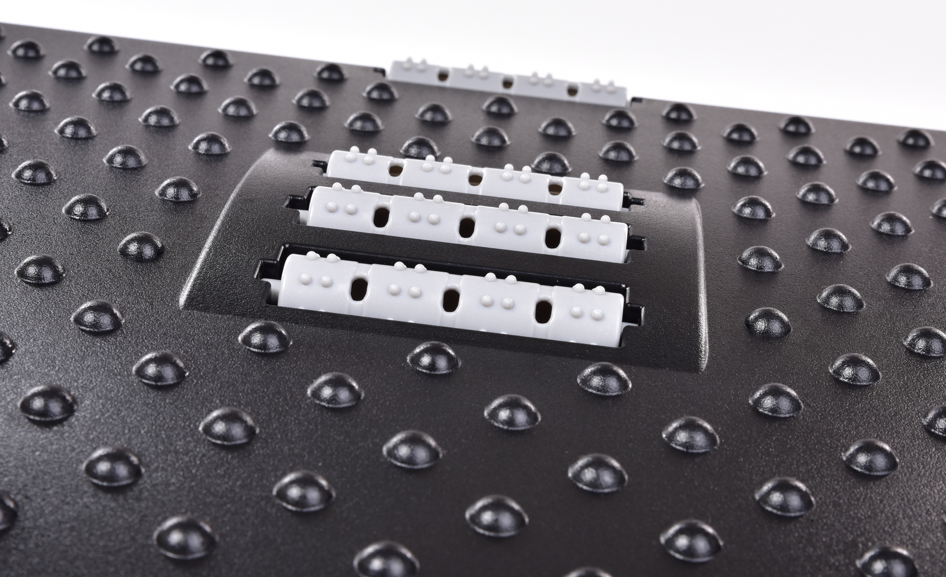 ANATOMIXX® masážna podnožka pod nohy pre relaxáciu a zdravé sedenie